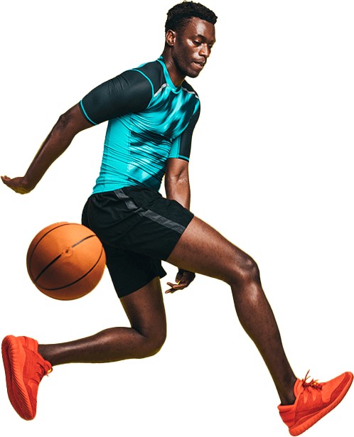 boy making a between the legs pass with a basketball