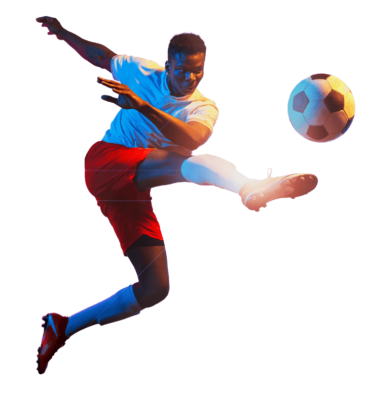 boy kicking a soccer ball